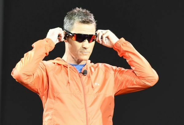 In this photo released by Intel Corporation, three time Ironman World Champion Craig Alexander previews the first look of ?Radar Pace,? smart eyewear by Oakley featuring a first voice-activated, real-time coaching system demonstrated during Intel CEO Brian Krzanich?s keynote presentation at 2016 CES (Consumer Electronics Show) on Tuesday, January 5, 2016 in Las Vegas, Nevada.  The smart eyewear is engineered with Intel innovation to provide fitness professionals and enthusiasts with in-the-moment feedback and analytics, helping to track and improve real-time performance*.  CES is one of the world?s largest gathering places for all who thrive on consumer technologies and will run January 5-9, 2016 in Las Vegas. (Photo by Intel Corporation/Bob Riha, Jr.) *These devices have not been authorized as required by the rules of the Federal Communications Commission. These devices are not, and may not be, offered for sale or lease, or sold or leased, until authorization is obtained.