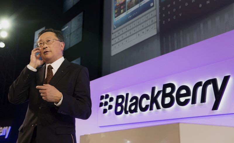 John Chen, chief executive officer of BlackBerry Ltd., speaks on a Passport smartphone during a Bloomberg Television interview at a product announcement in Toronto, Ontario, Canada, on Wednesday, Sept. 24, 2014. The square-screened Passport is BlackBerry's first major new device slated for a global introduction since Chen set out in November to turn around the company by shifting away from the consumer market toward business and professional users. Photographer: Hannah Yoon/Bloomberg *** Local Caption *** John Chen