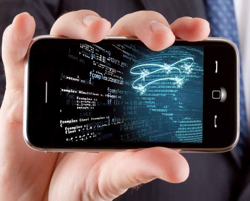 Hombre de negocios mostrando un telfono tctil con una imagen conceptual de redes globales.